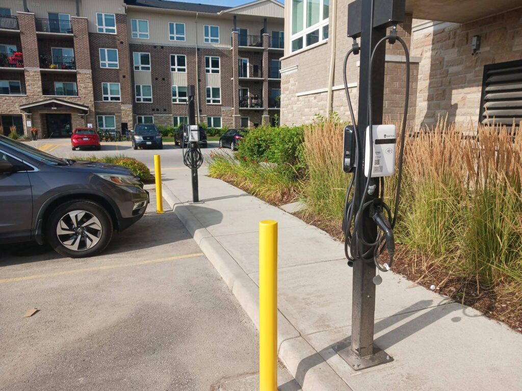 SWTCH EV chargers installed in the parking lot of an apartment complex